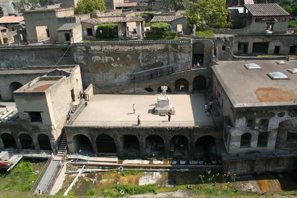 Herculaneum, April 2011. 
Looking north from access roadway towards the Sacred Area, to the left of the Terrace of Marcus Nonius Balbus.
Above this area are the terraces of the Houses of the Mosaic Atrium, (left) and of the Stags, (in centre). 
Photo courtesy of Klaus Heese.